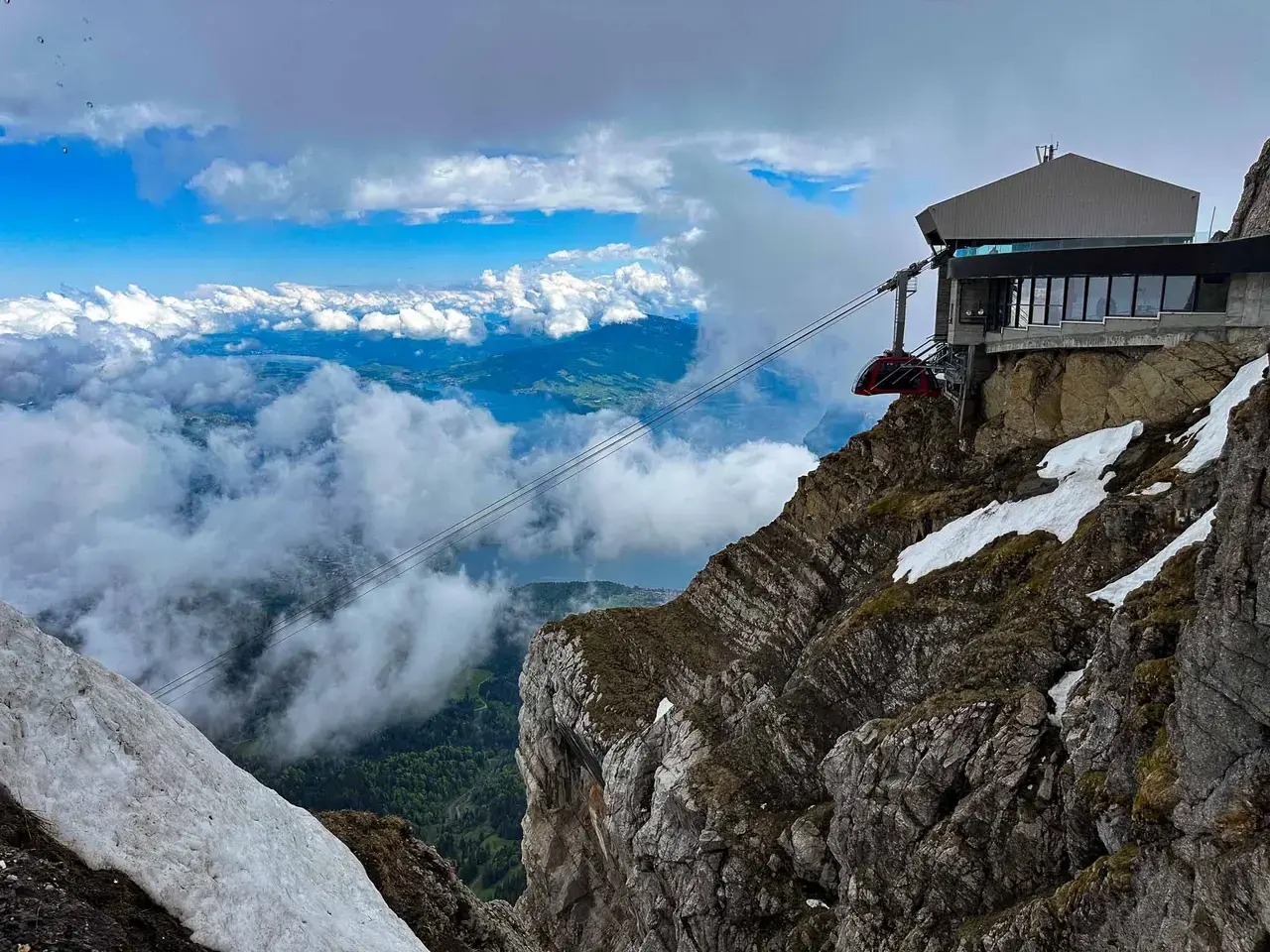 A hilltop castle overlooking a lake and mountains