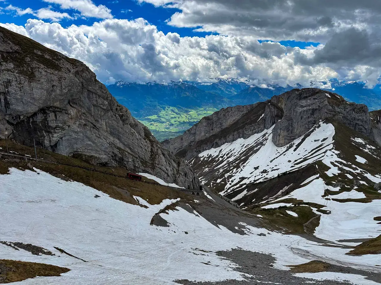 Snow-streaked mountains above a lake