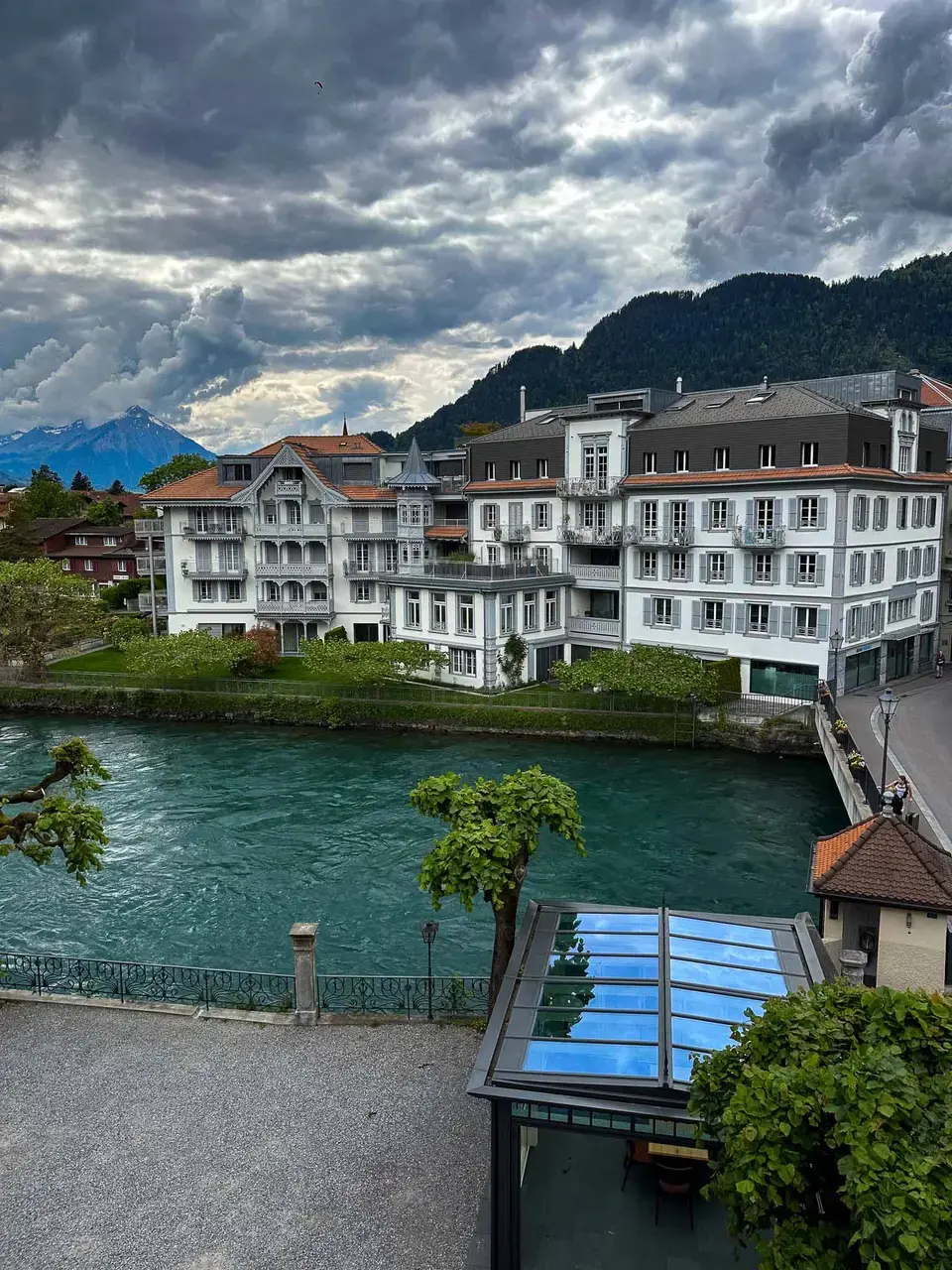 A traditional lakeside village reflected in calm water
