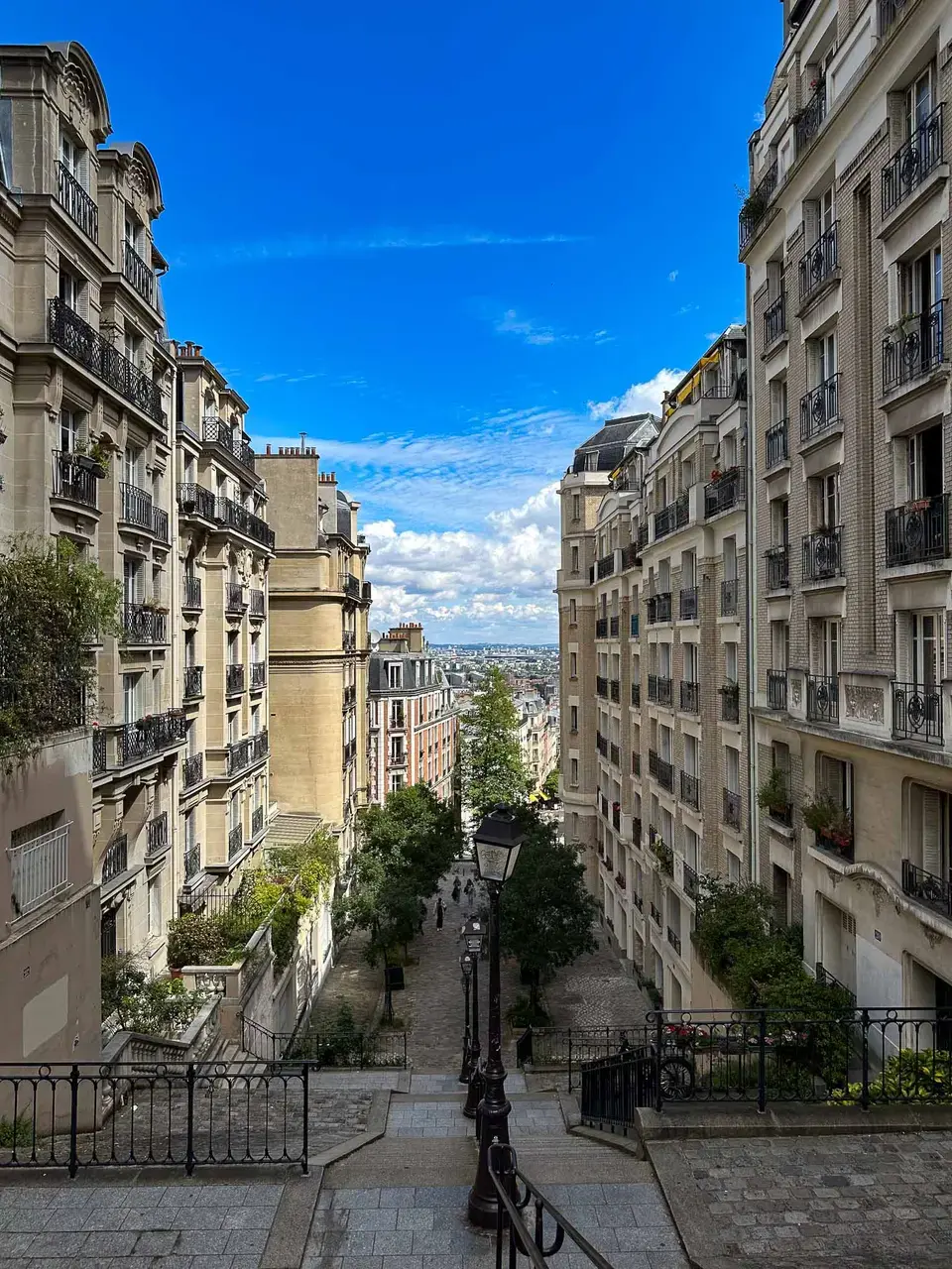 A quiet street between historic buildings